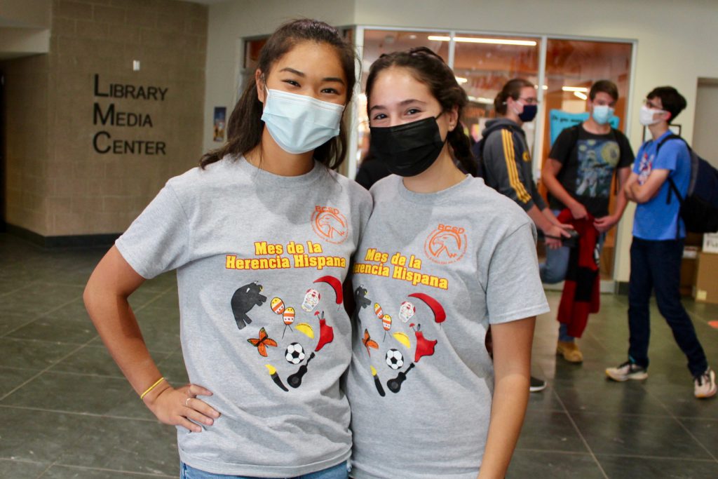 students pose in t-shirts