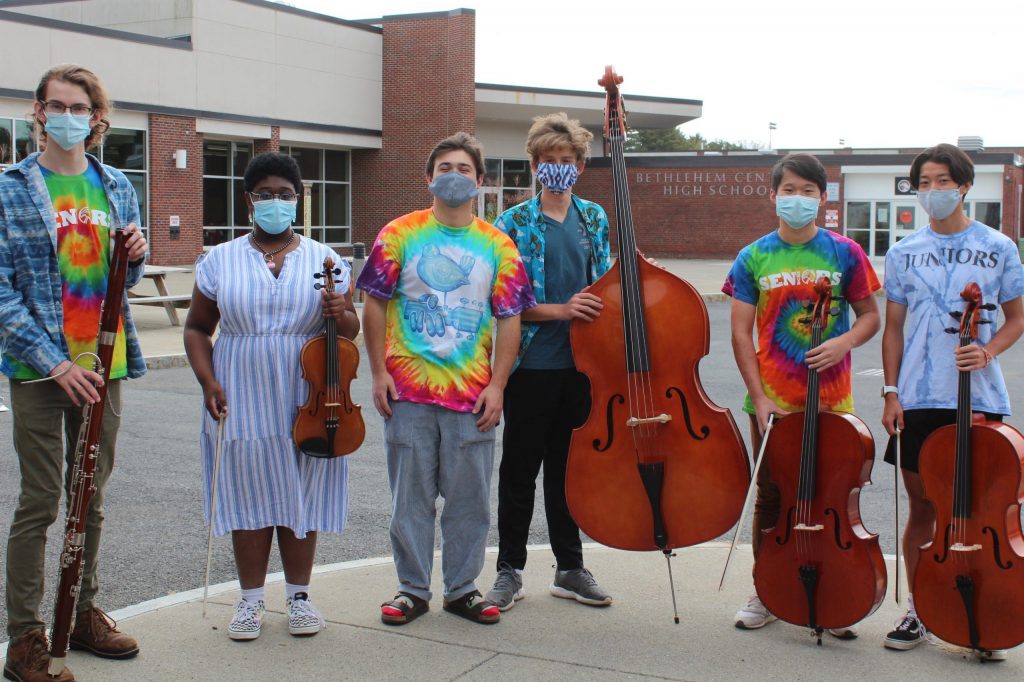 students pose with instruments