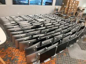 computer screens lined up on the ground