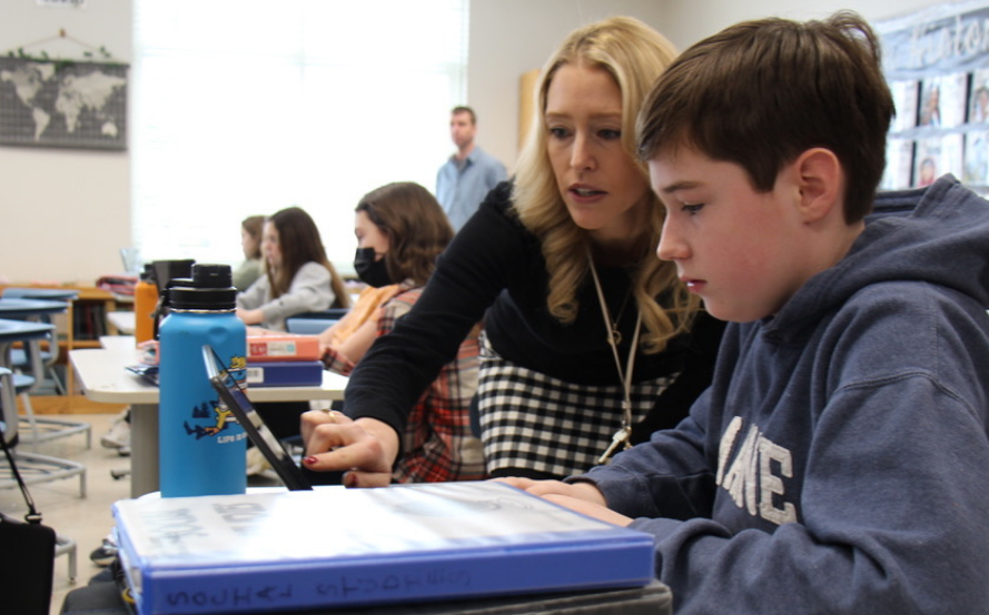 teacher working with one student