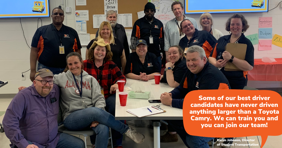 group of bus drivers smiling