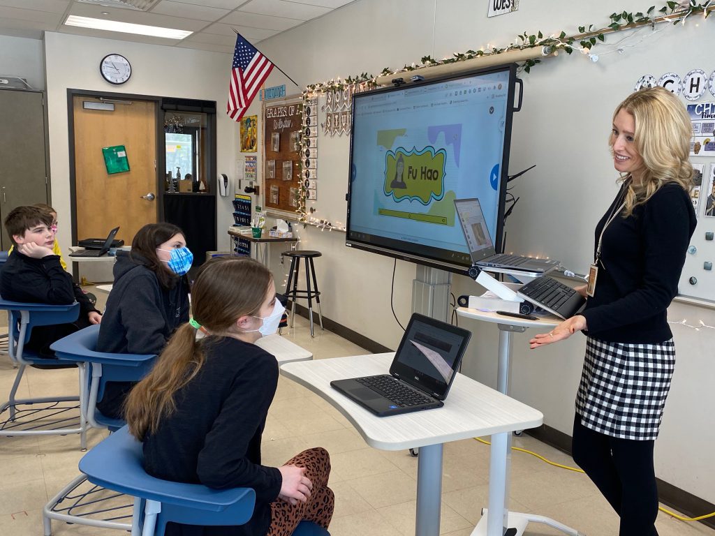 teacher working with one student