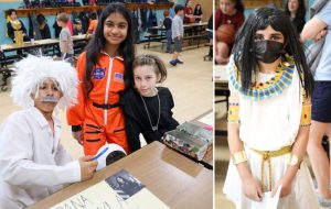 Students posing together in wax museum costumes