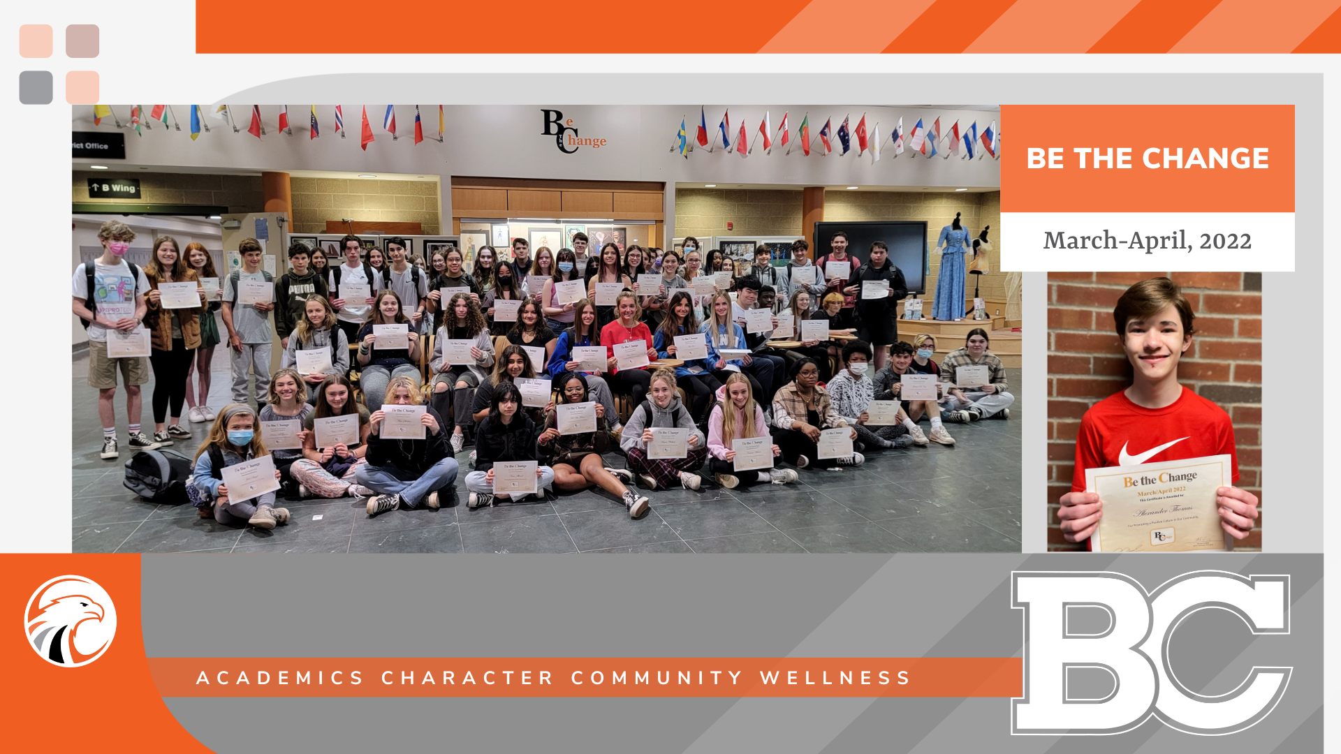 group of students pose for photo in high school foyer