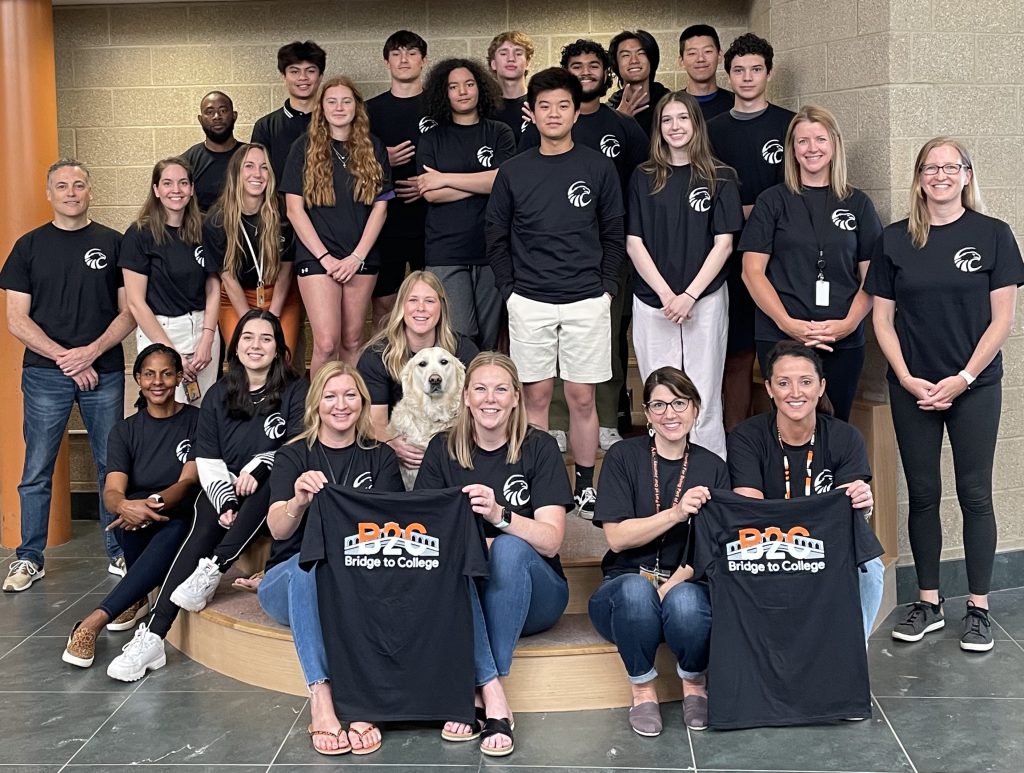 group of students and staff pose for photo in BCHS foyer