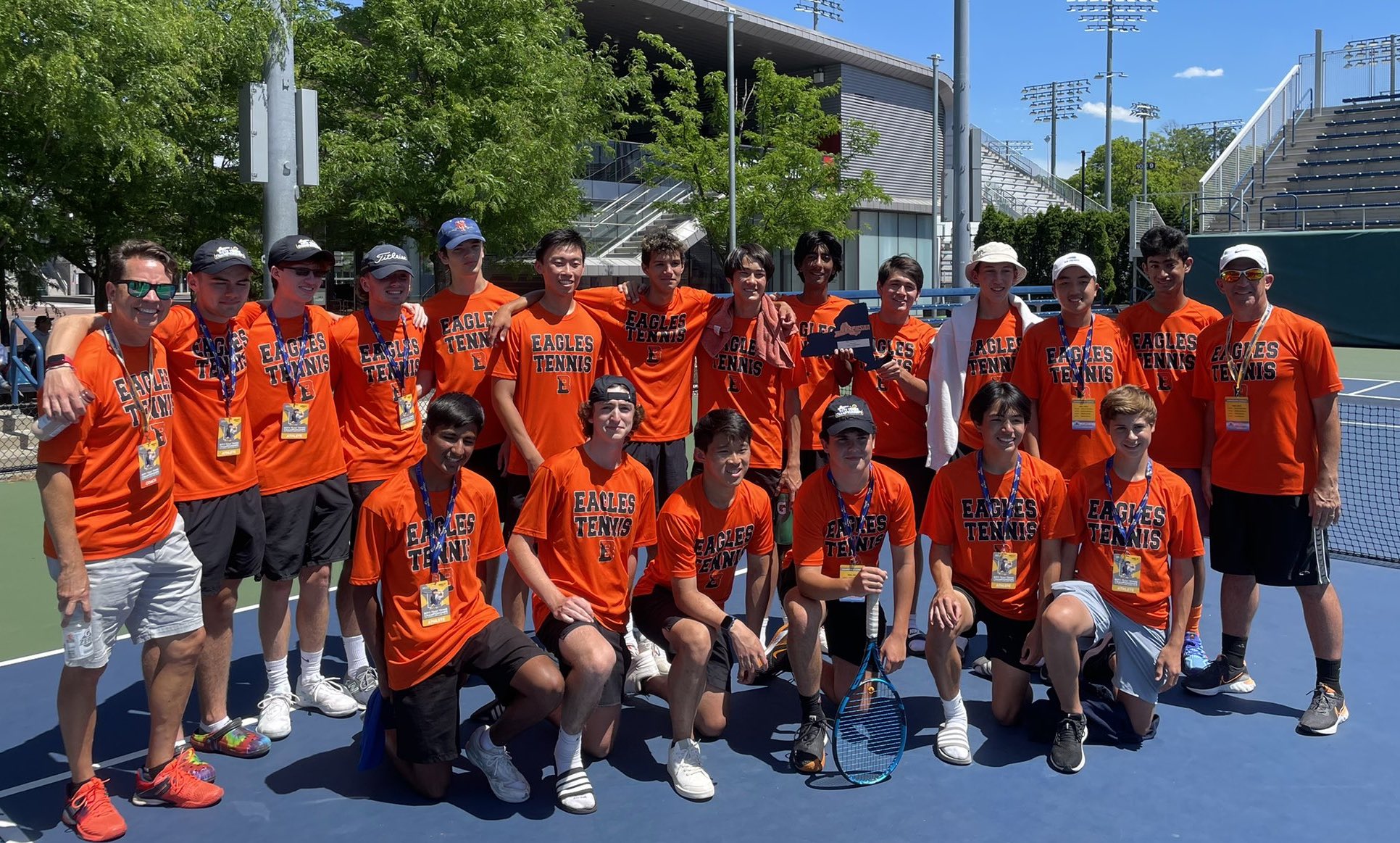 team of tennis players pose for photo