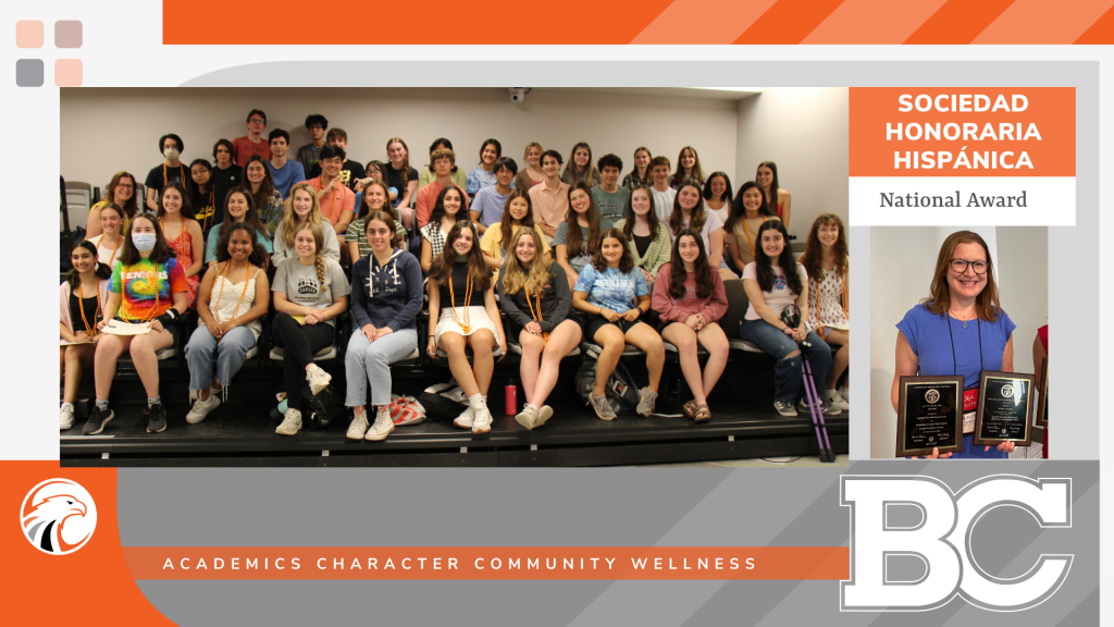 group of students plus photo of person holding two awards