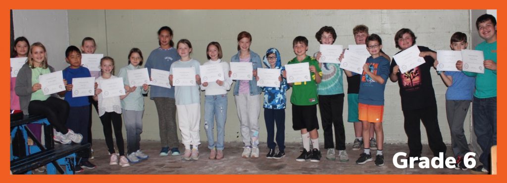 students holding certificates
