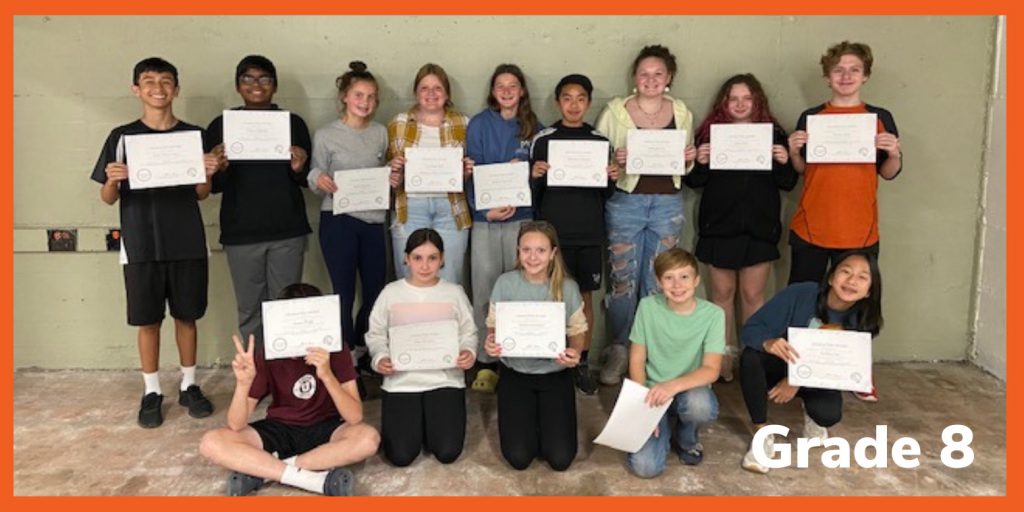 students holding certificates