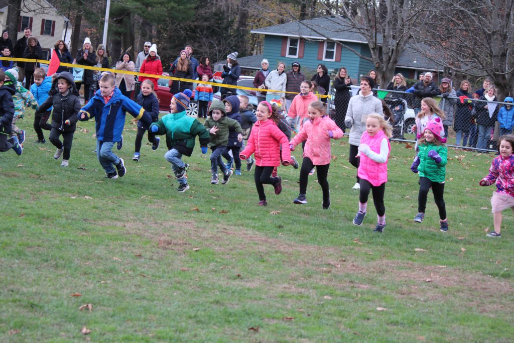 students running across grass