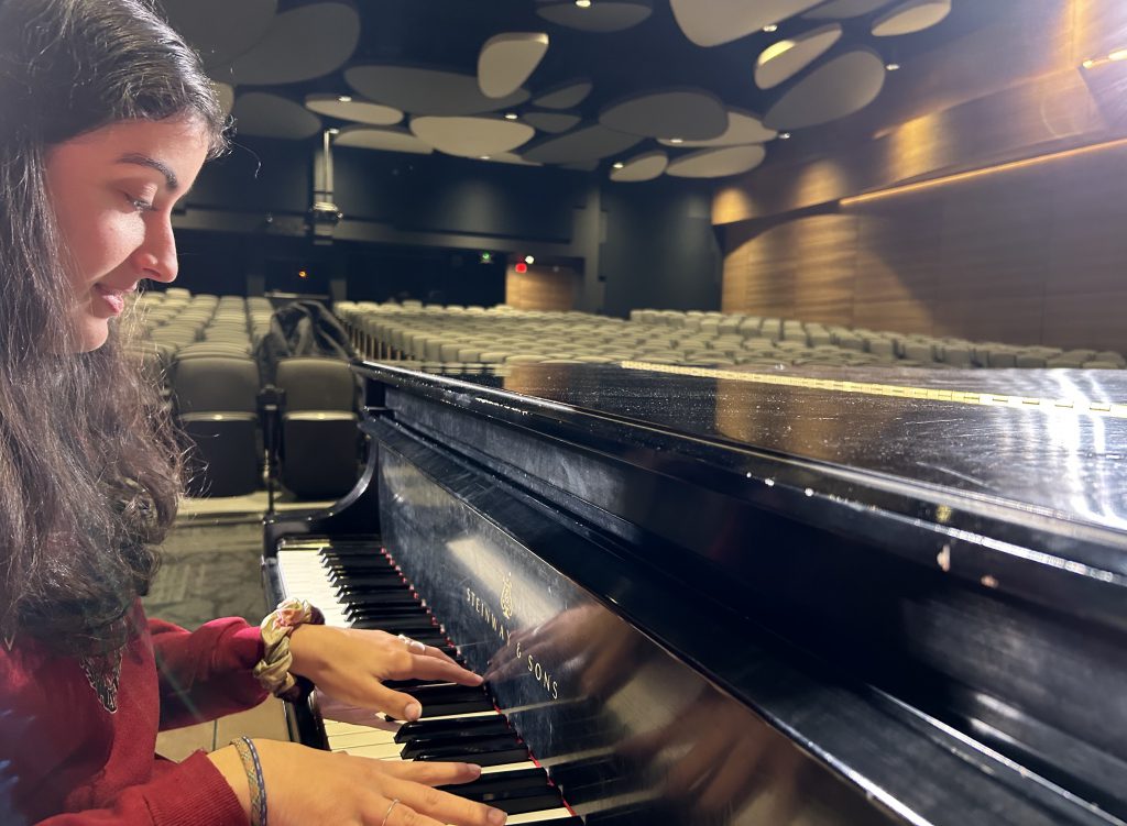 student playing the piano