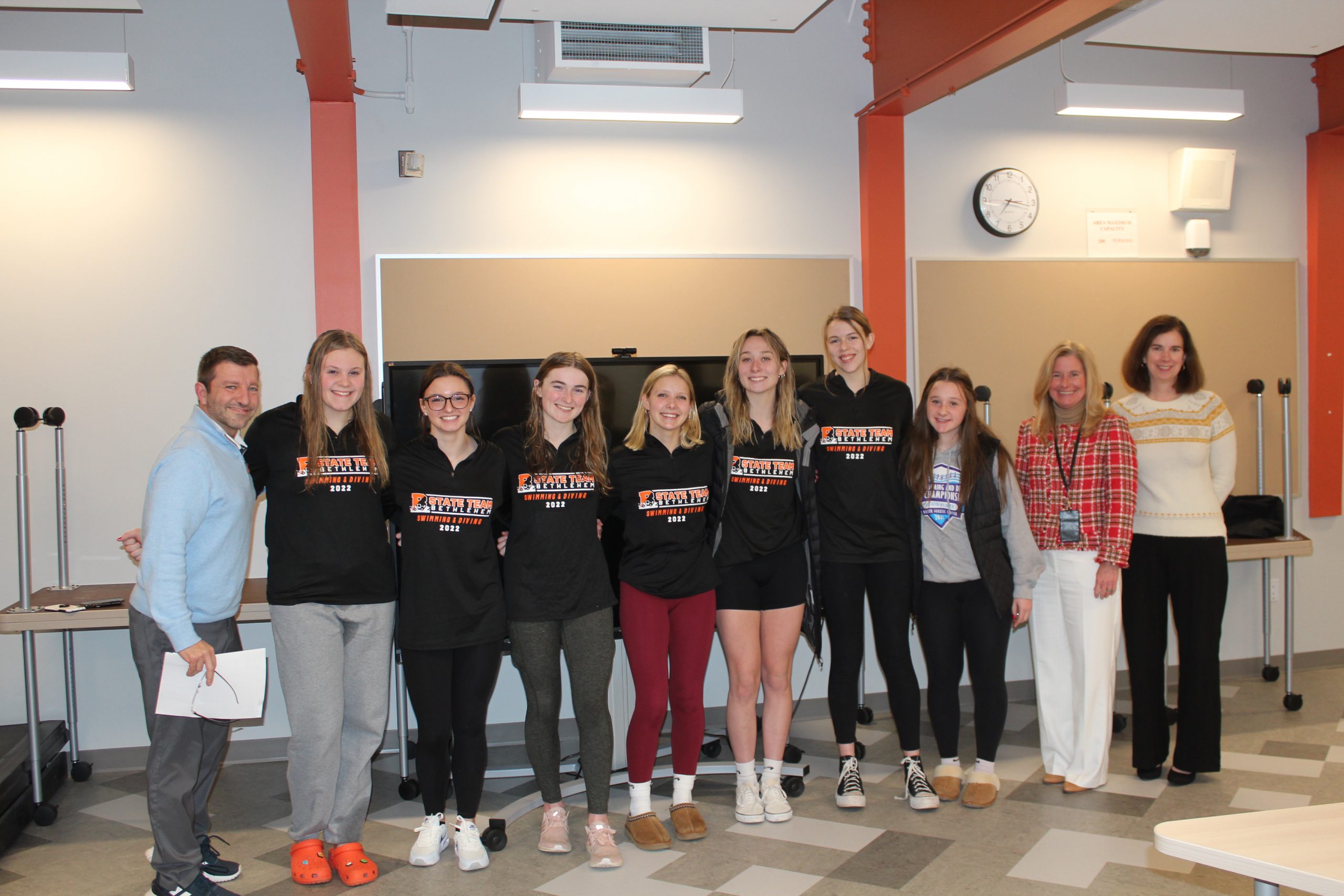 Girls Swim Team pictured with Athletic Director Len Kies, Superintendent Jody Monroe, and Board of Education President Holly Dellenbough