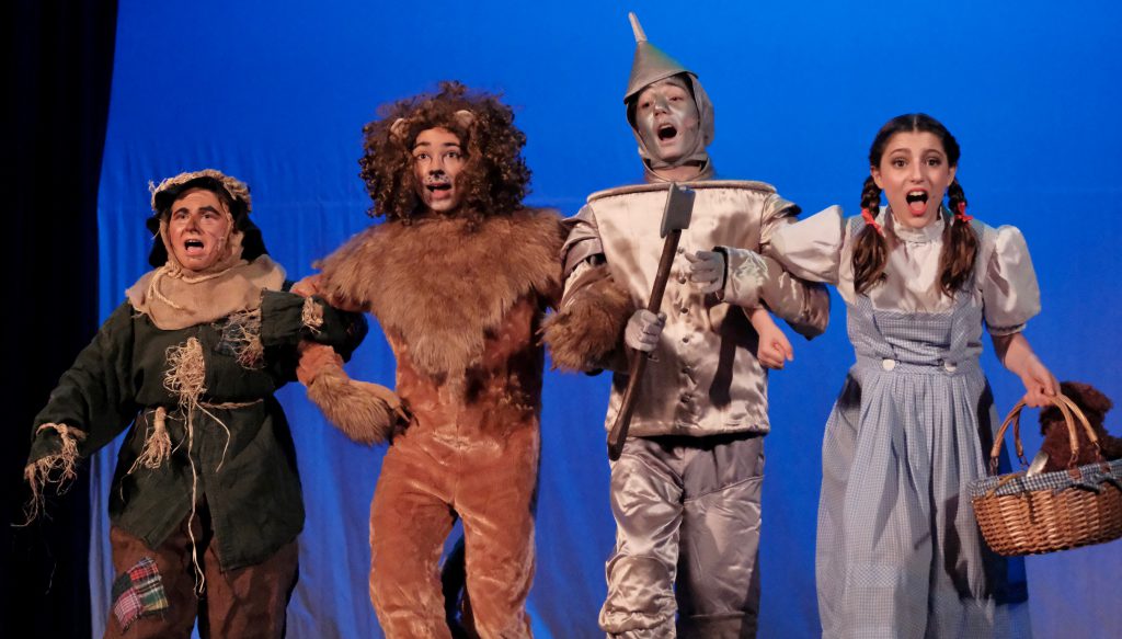 students dressed up like Dorothy, Scarecrow, Tin Man and Cowardly Lion