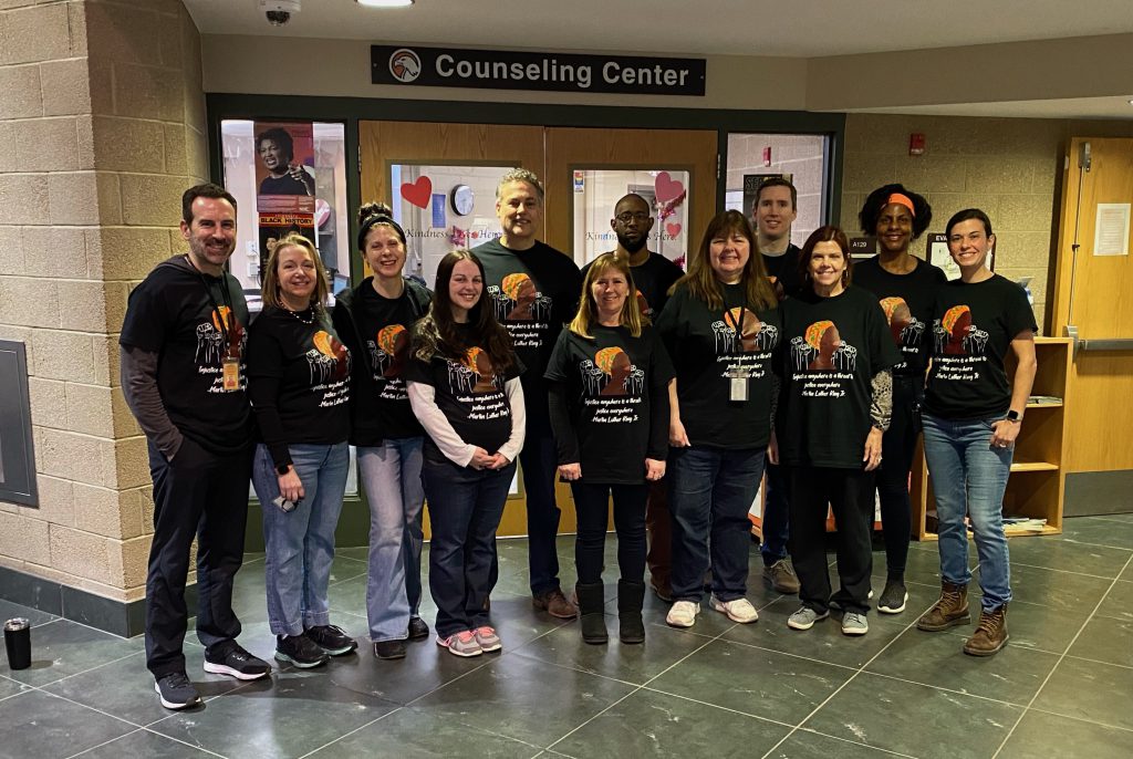 group of counselors wearing matching t-shirts