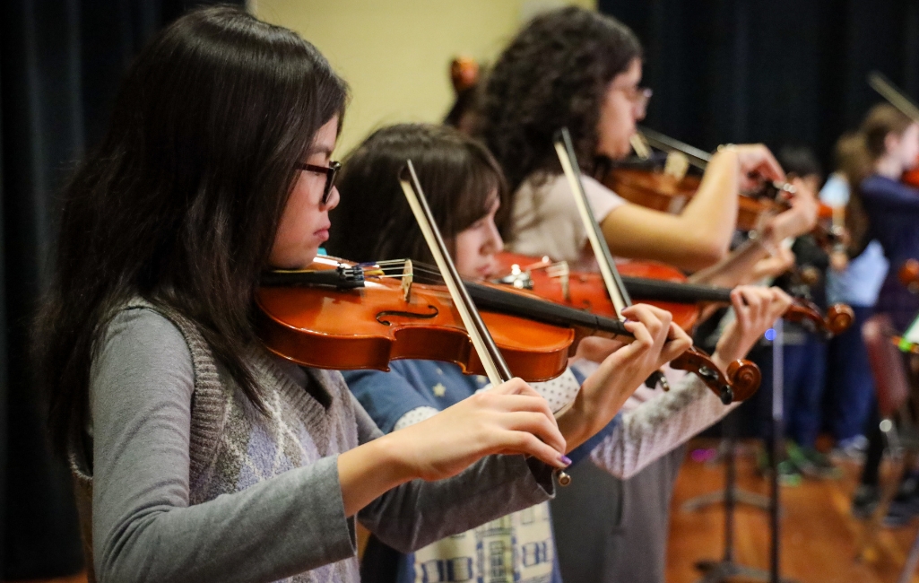 Students perform as part of a string ensemble