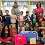group of students holding food items