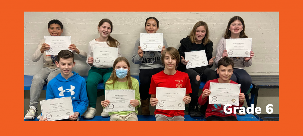 group of sixth graders holding certificates