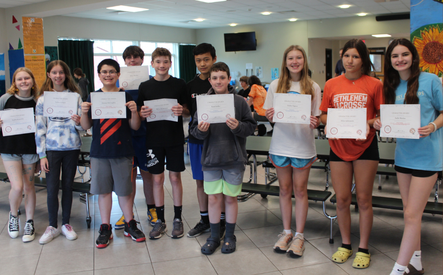 group photo of students holding certificates