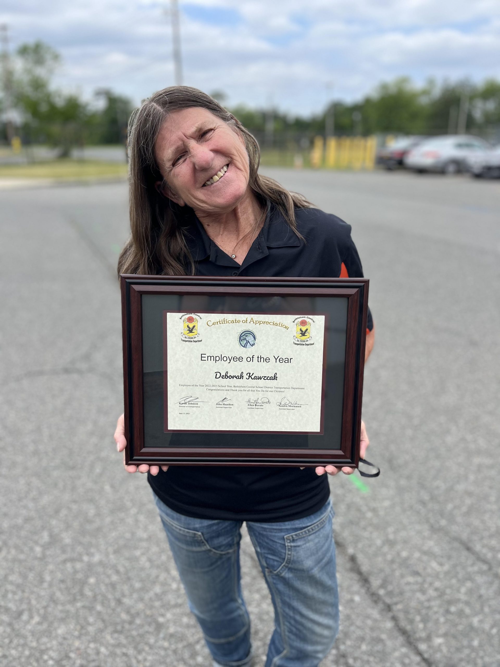 Debbie Kawczak poses with her Employee of the Year Award