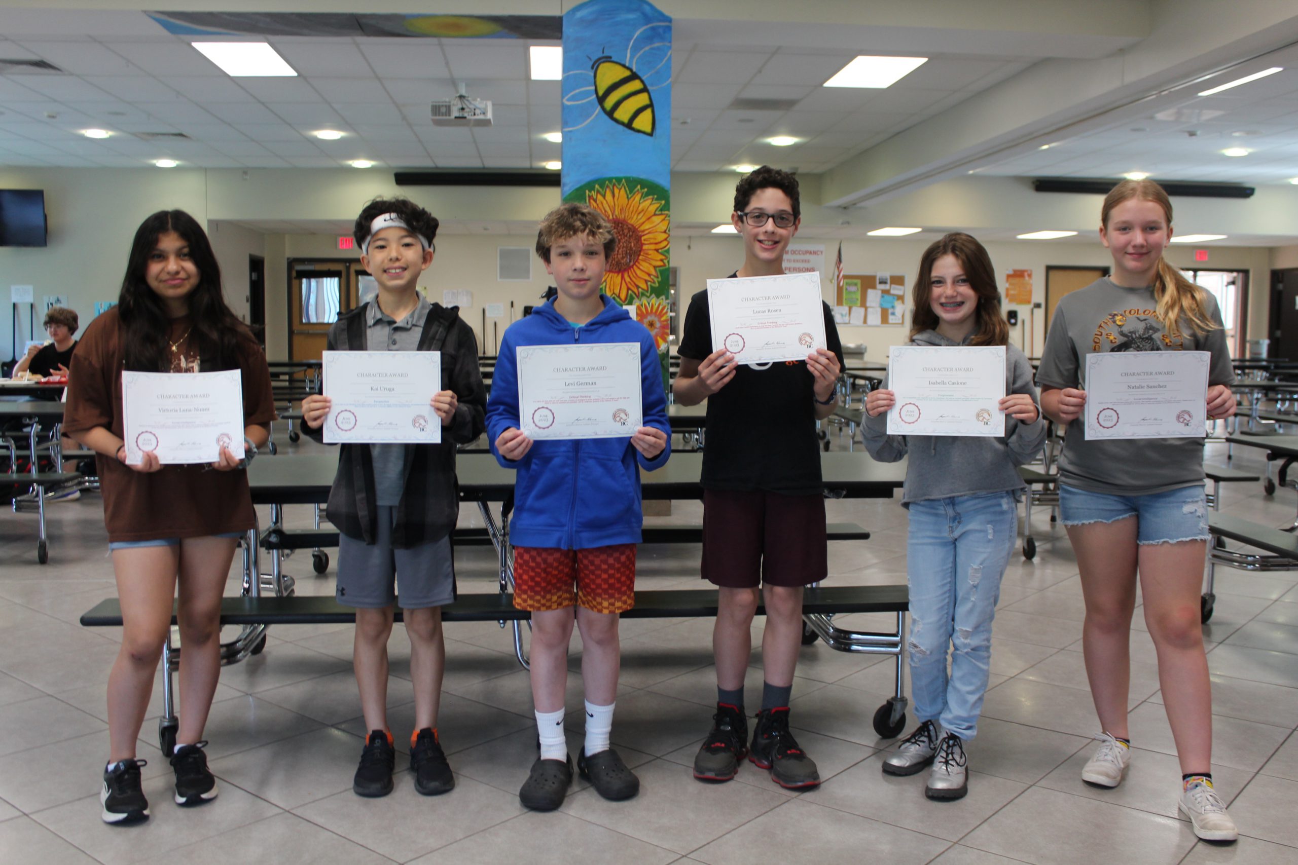 group photo of students holding certificates