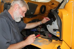 person working on school bus