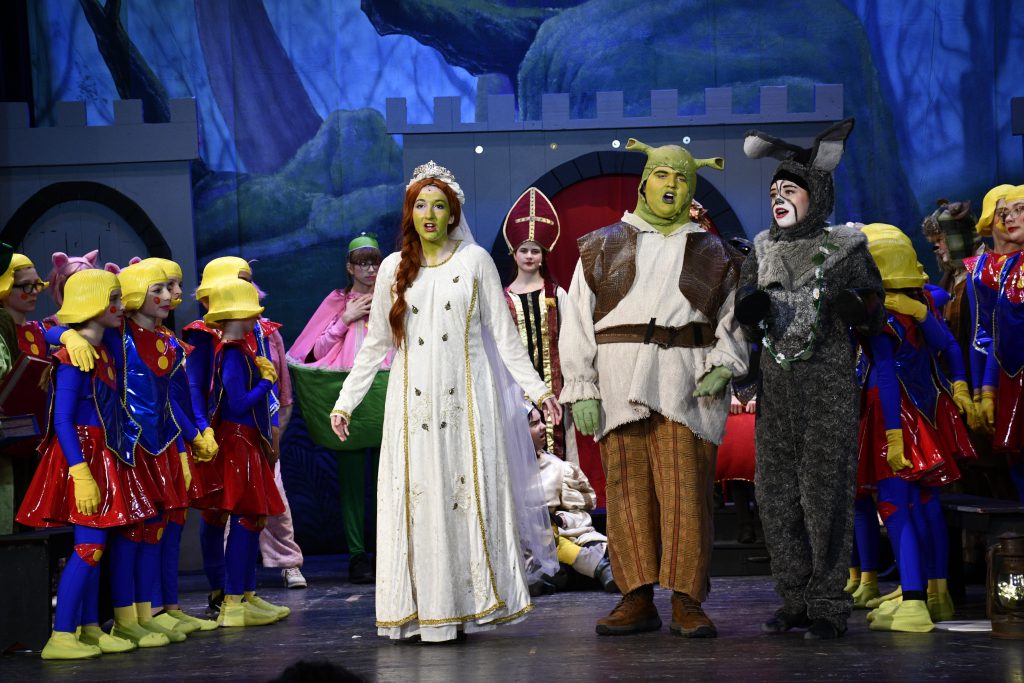 students on stage in costume