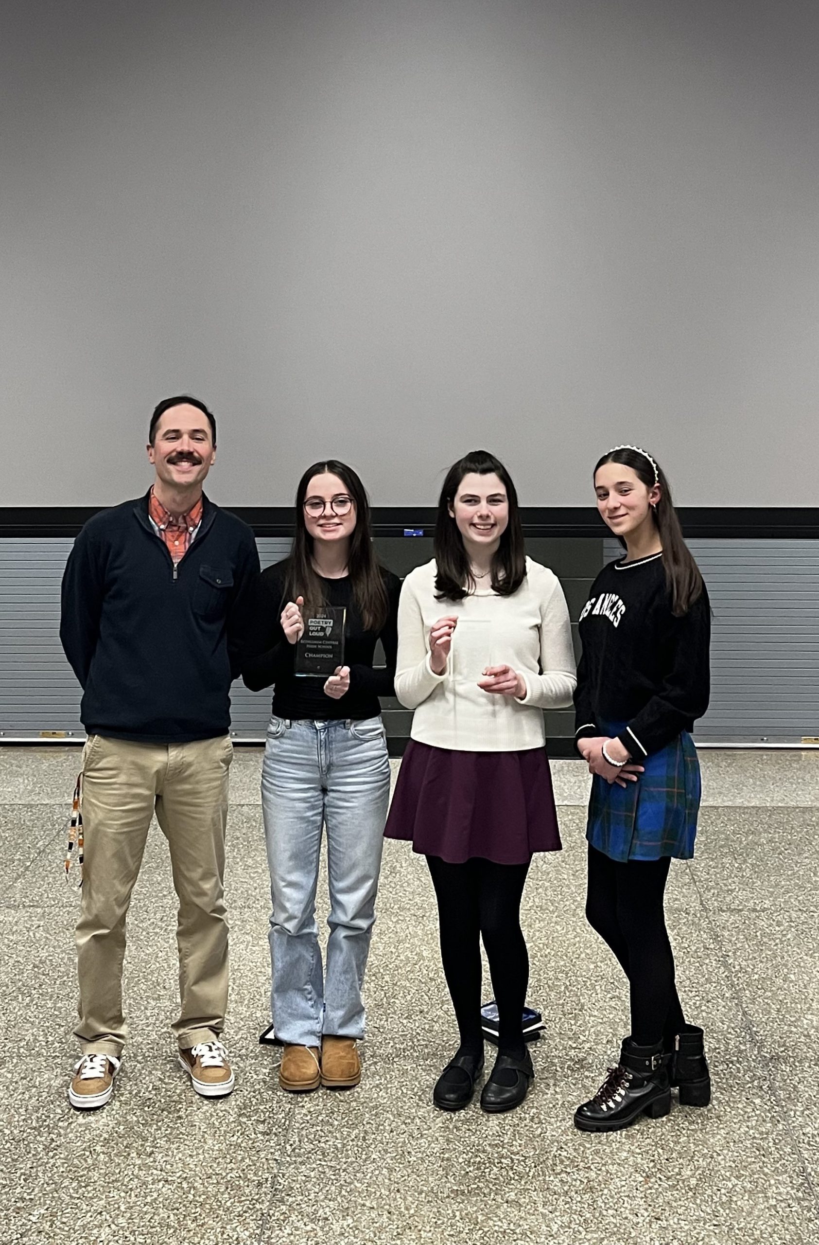 Andrew Rickert poses with Winner, Gabby Richards, Runner-Up Laurel Muench and Honorable Mention Xrysanthi Muench