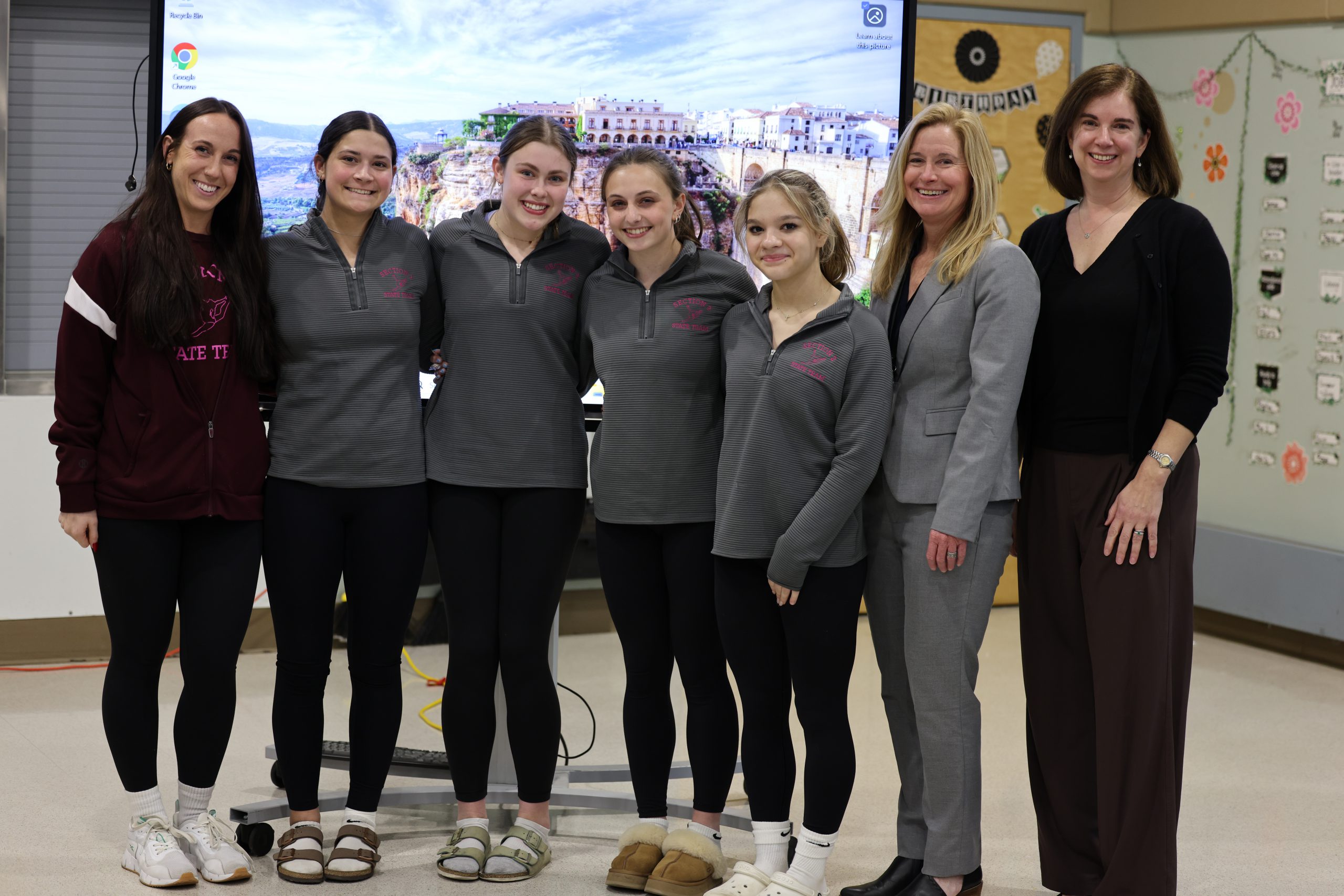 Girls Gymnastics Team pictured with Superintendent Jody Monroe and Board of Education President Holly Dellenbaugh