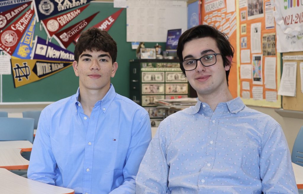 two students in blue shirts