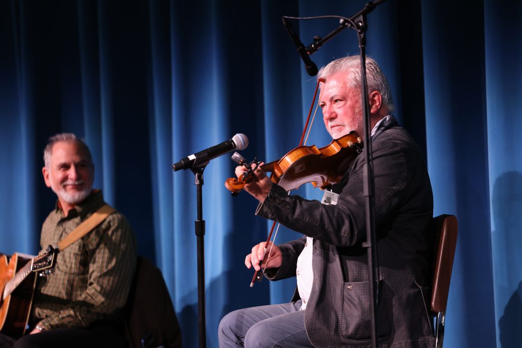 musicians perform on stage