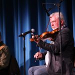 musicians perform on stage