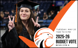 student in cap and gown holding up fingers as peace signs
