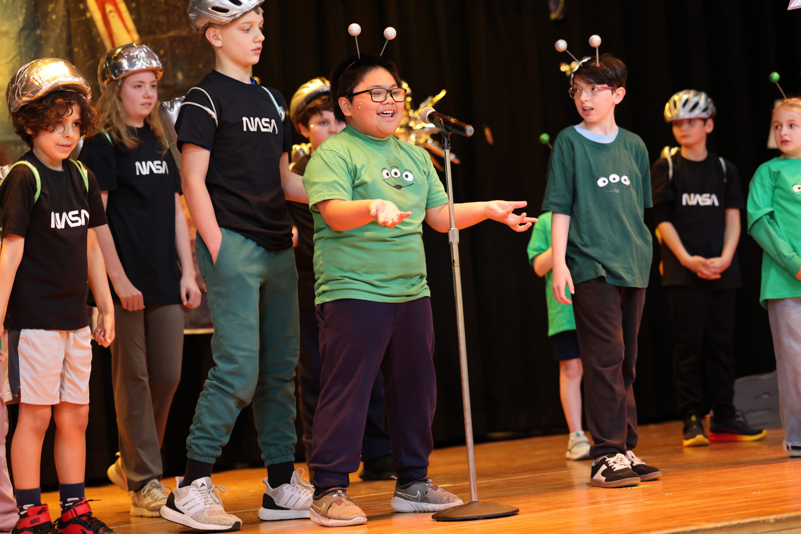 students performing on stage