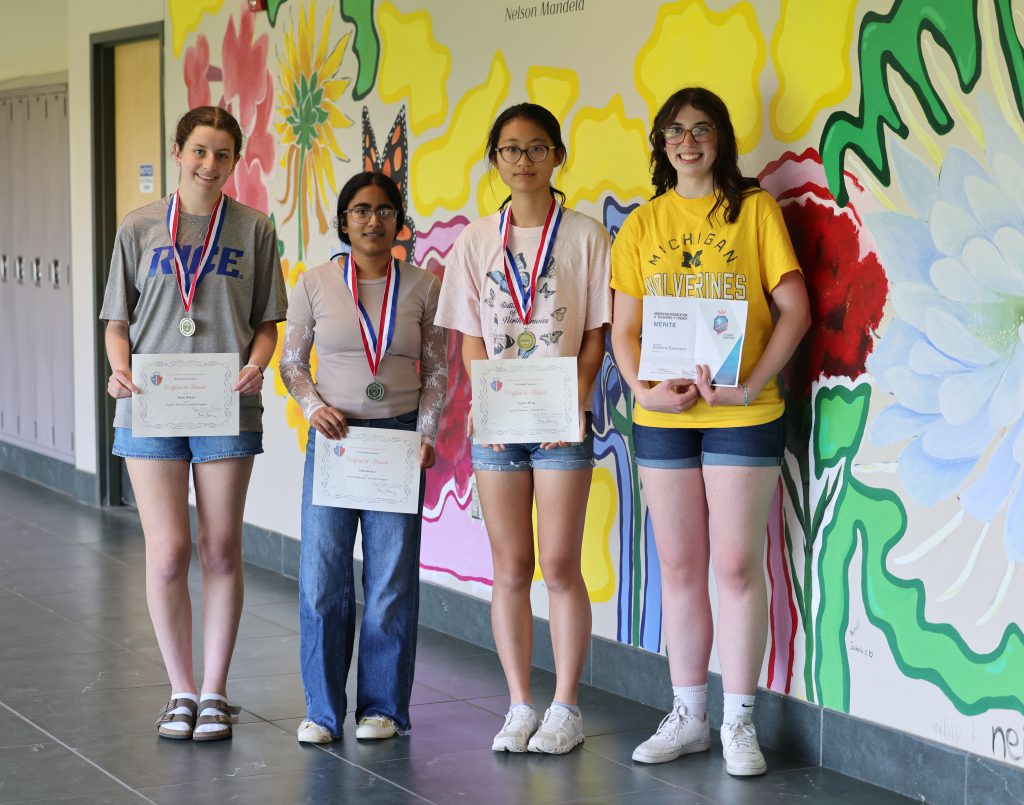 students holding certificates