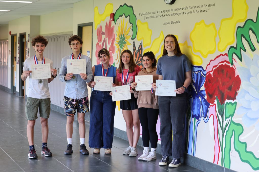students holding certificates