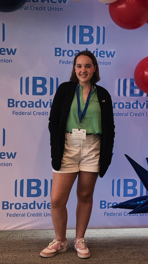 student standing and posing for photo