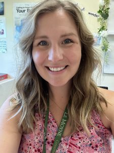 person smiling in a classroom