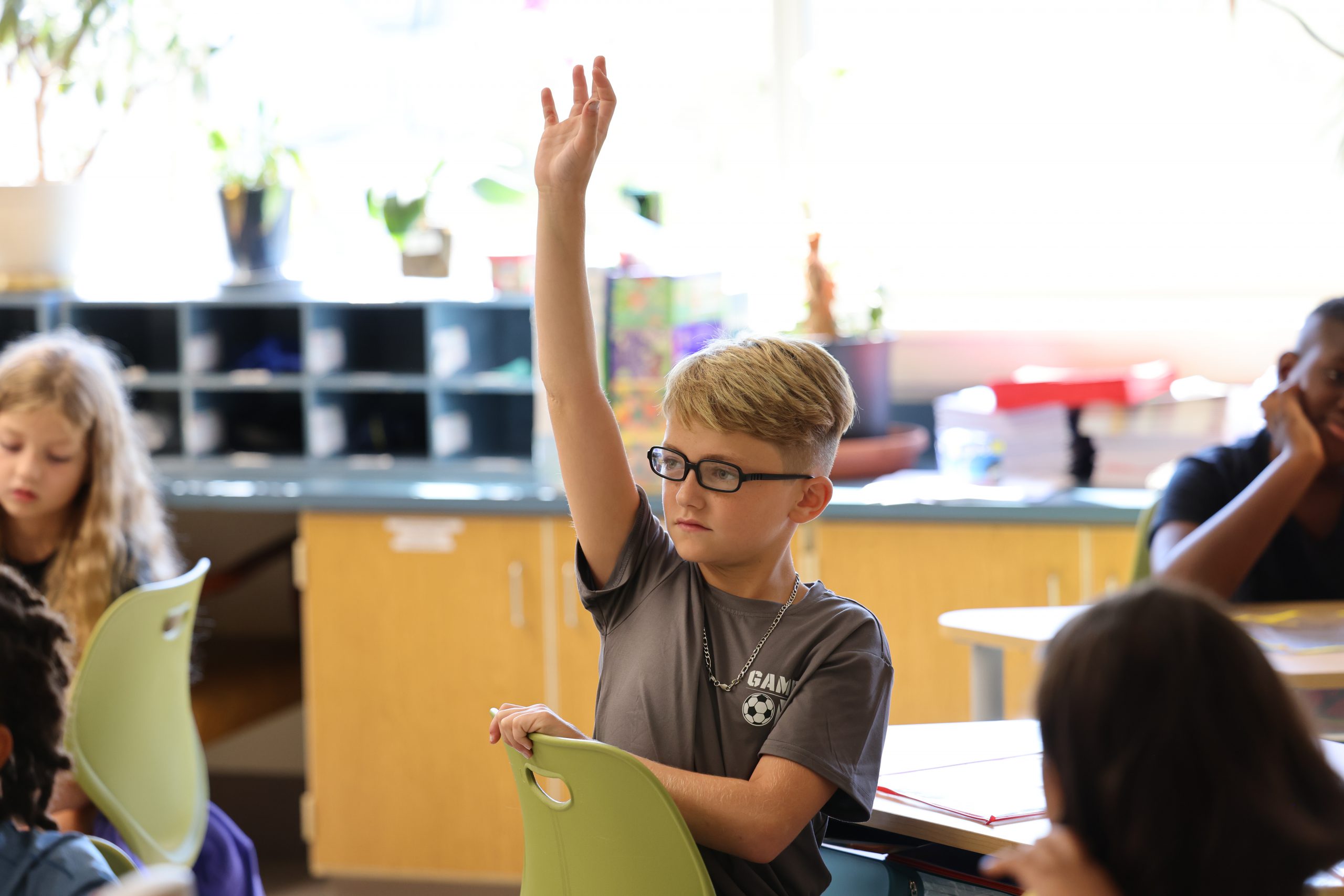 student raising hand