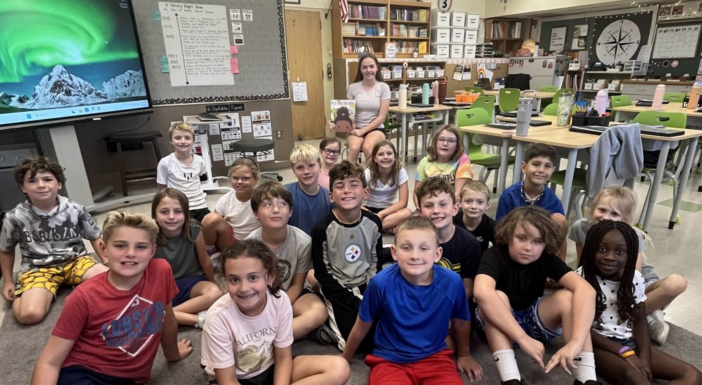 high school students read to elementary students