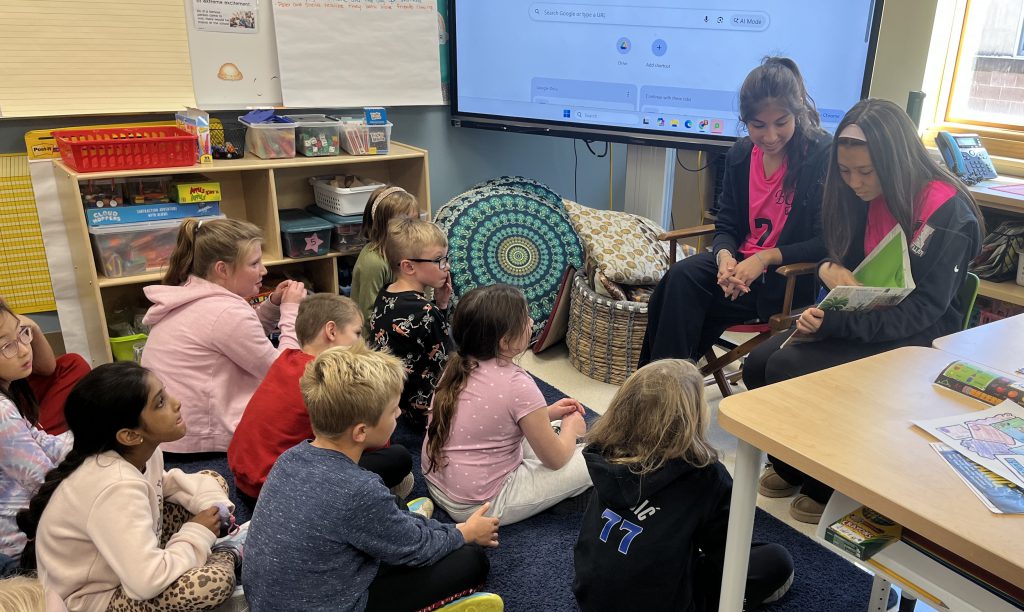 high school students read to elementary students