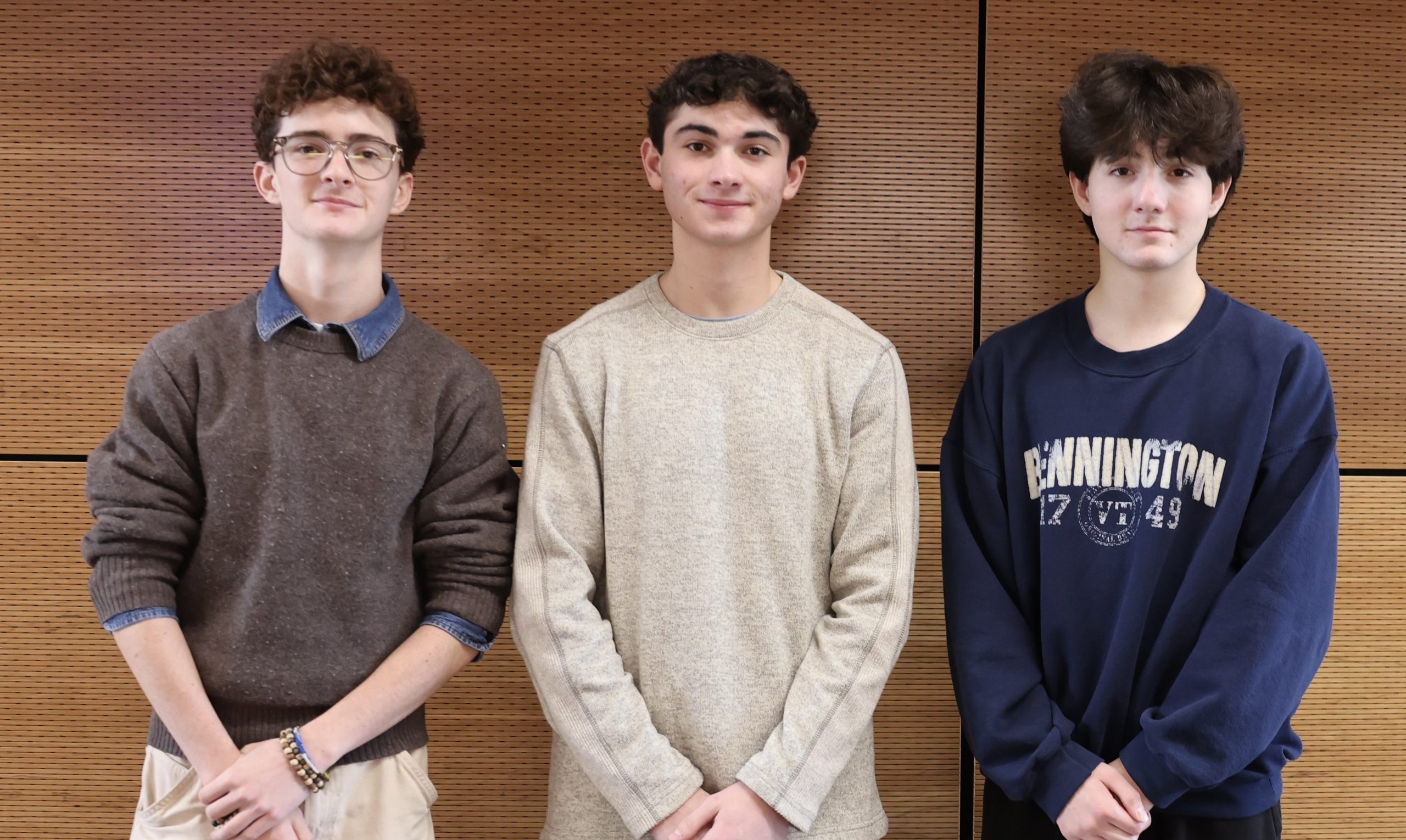 three students pose for photo