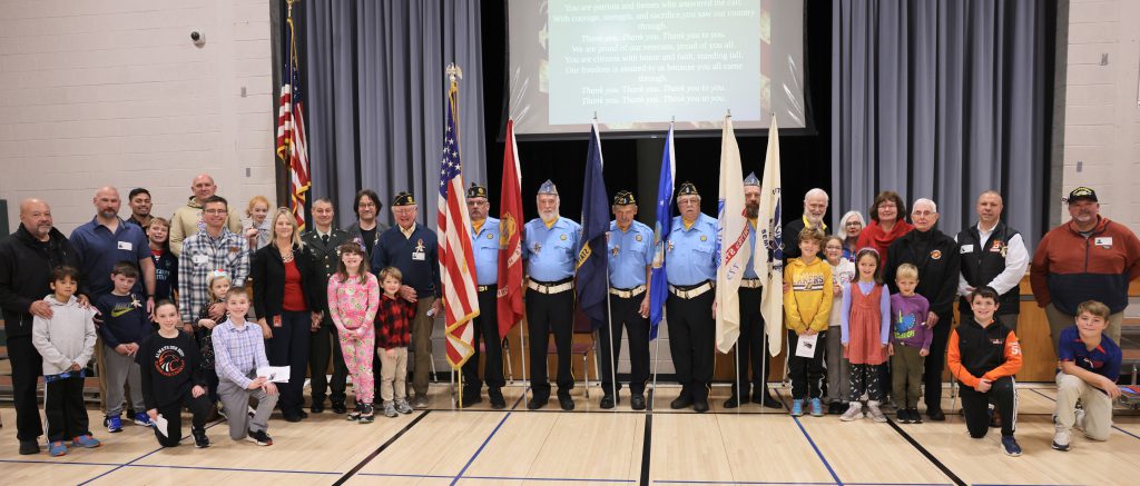 group photo of veterans and students