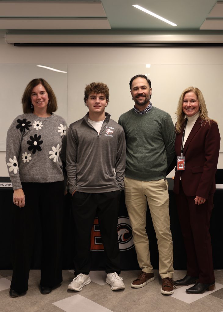 Image of BOE President Holly Dellenbaugh, Calvin Howard, Coach Andrew Rickert and Superintendent Jody Monroe