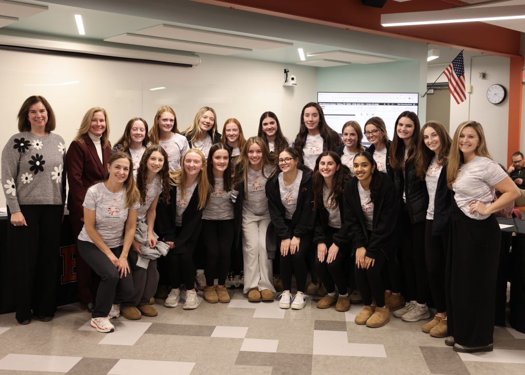 Image of BOE President Holly Dellenbaugh, Superintendent Jody Monroe, the girls field hockey team and coaches