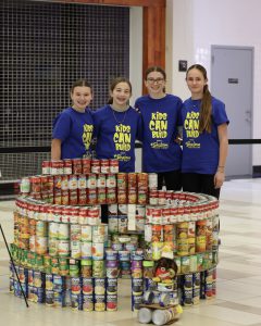 Image of Helping Hands Club members with their structure