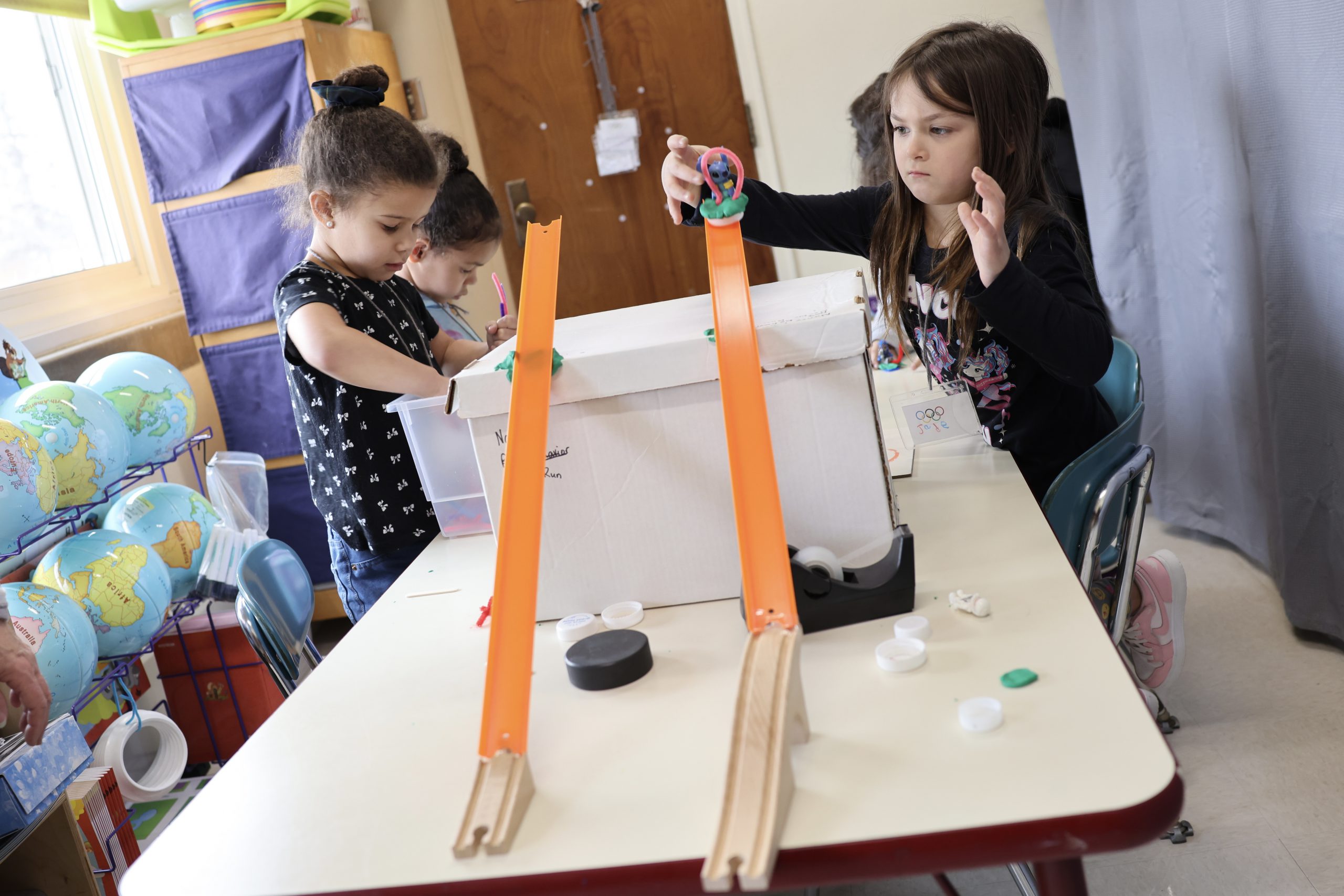 kindergarten students work on a project