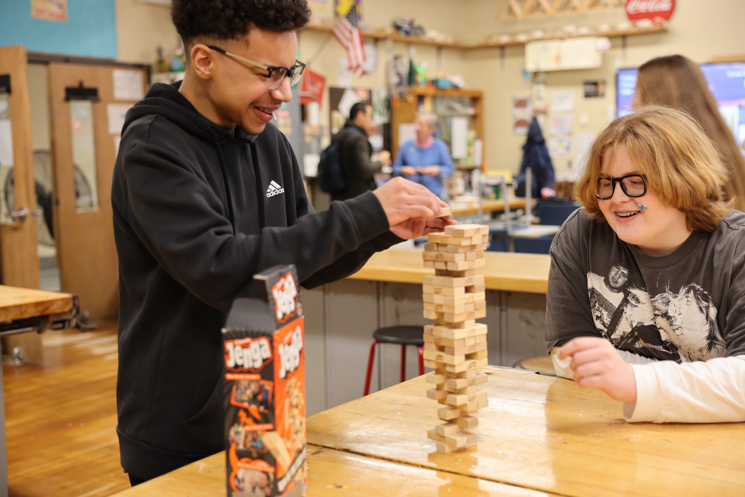 two students building tower