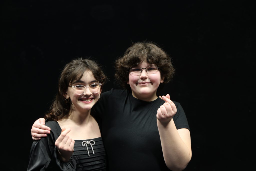 two students snapping fingers