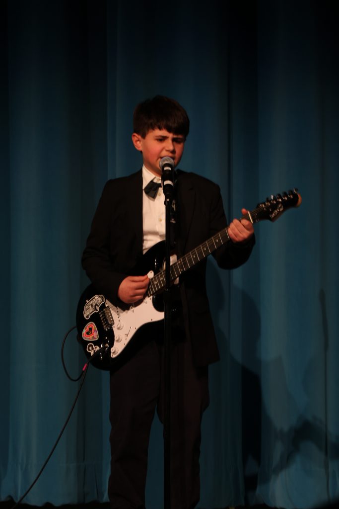 student playing guitar