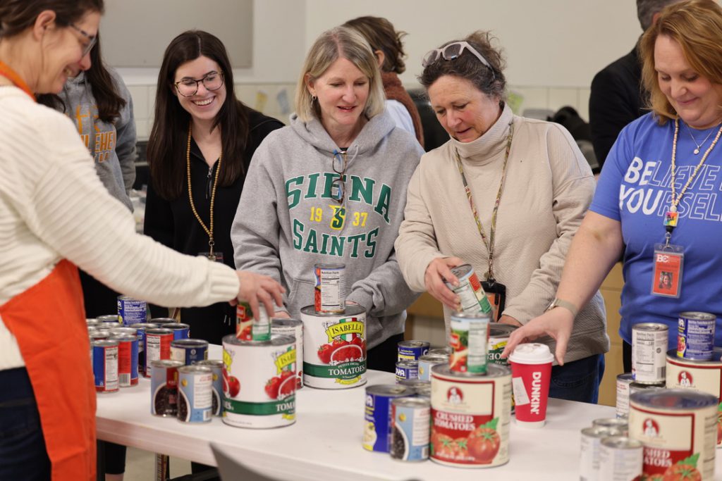 group organizing canned goods
